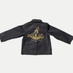 Bleu de Chine enfant noir avec broderie Madonuccia en fil doré au dos, pièce artisanale collection loru.corsica